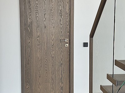 Oak floors, oak doors, oak stairs and oak deco wall - all in Graphite colour