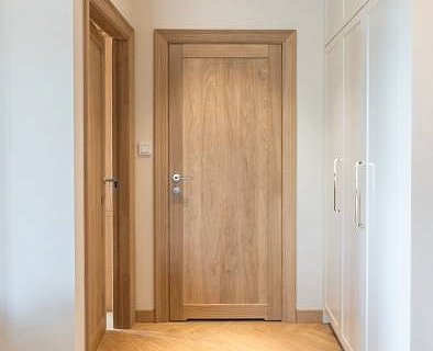 Naturale colour wood floors and panel style oak doors