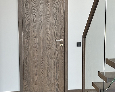 Oak floors, oak doors, oak stairs and oak deco wall - all in Graphite colour