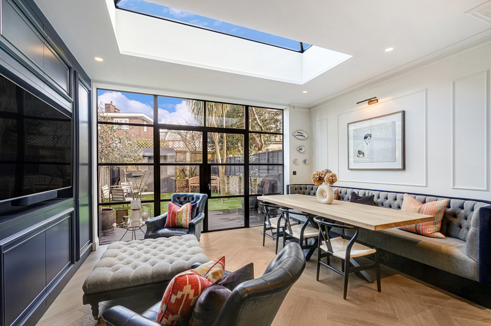 A loft conversion in Wandsworth, London, features herringbone wood flooring